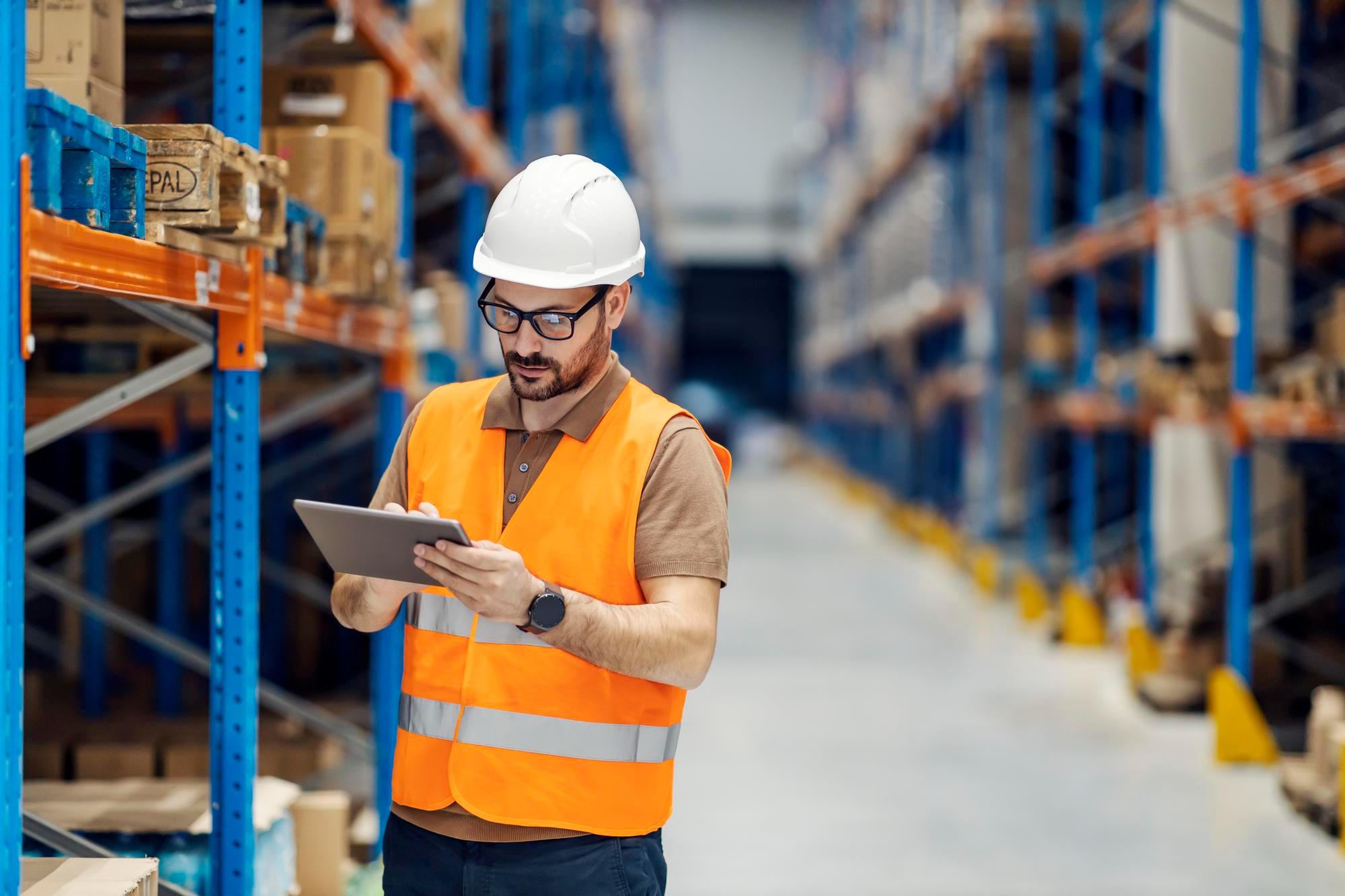 Warehouse manager overseeing operations